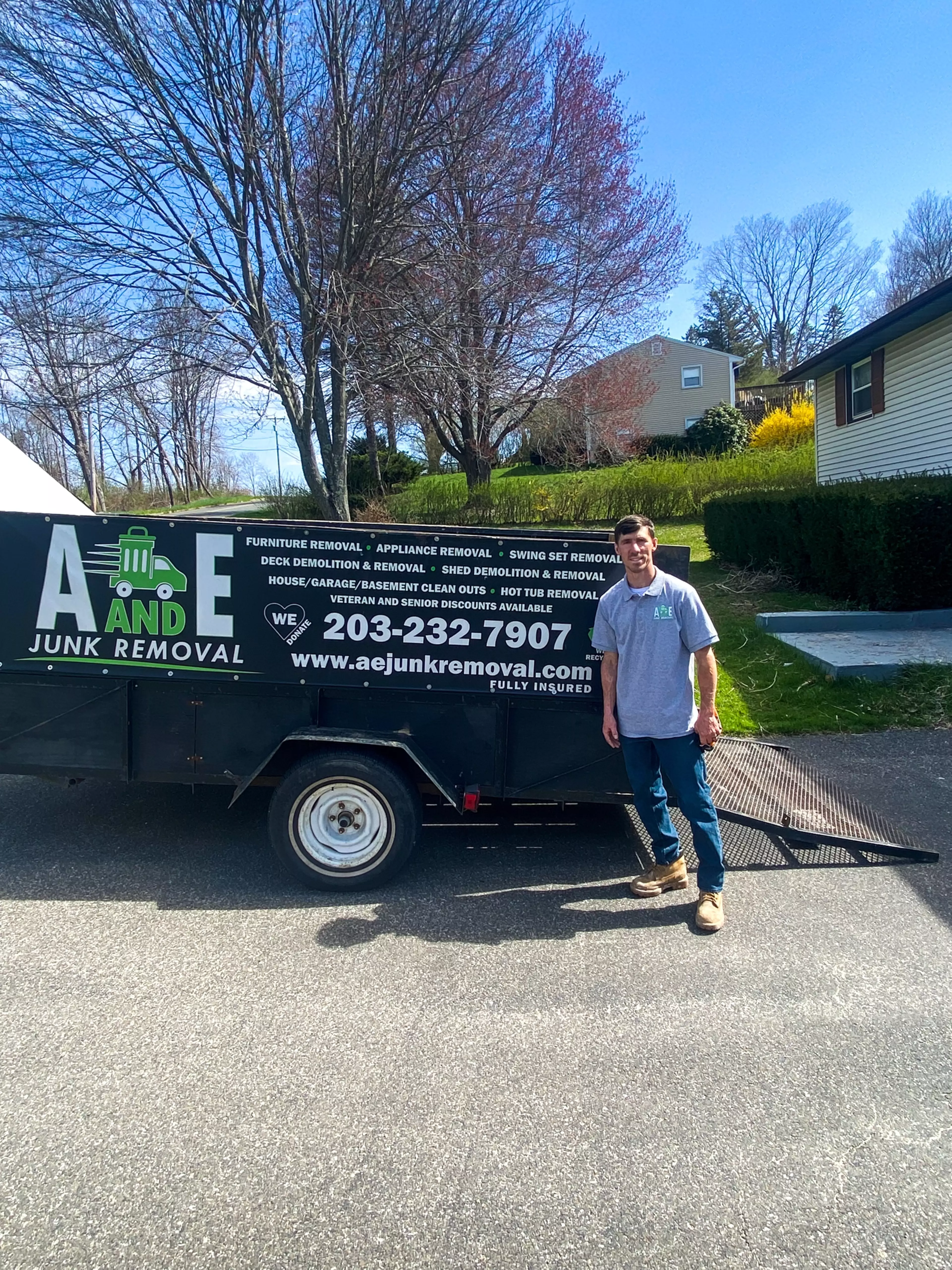 Owner Gary standing by A and E Junk Removal truck